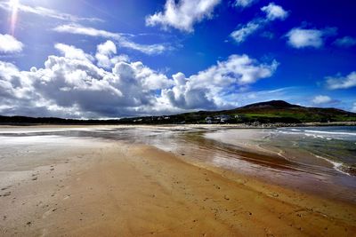 Scenic view of beach against sky