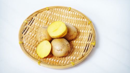 High angle view of fruits in basket on table