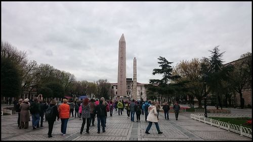 Tourists in front of building