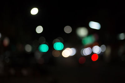 Defocused image of illuminated street lights at night