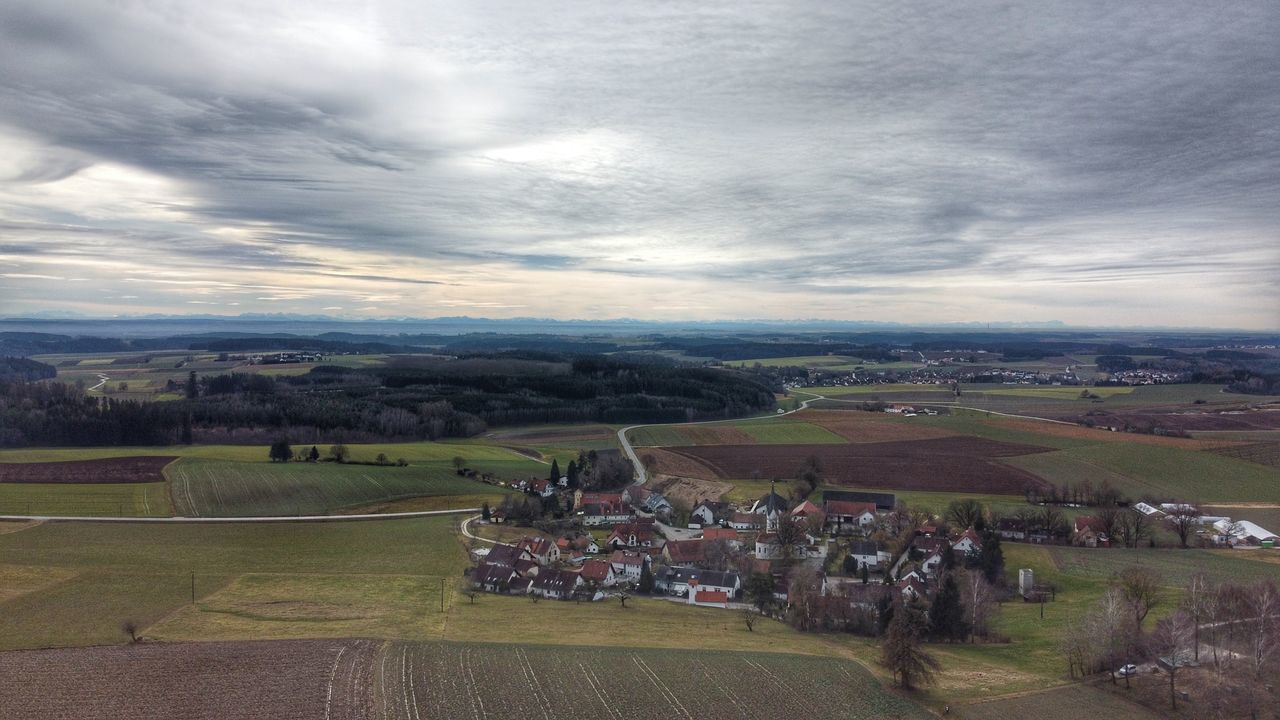 HIGH ANGLE VIEW OF AGRICULTURAL LANDSCAPE AGAINST SKY