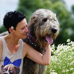 Happy woman with irish wolfhound at park