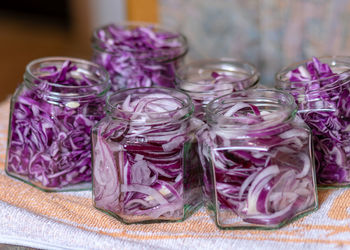 Close-up of multi colored glass jar on table