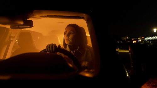 Low section of woman in car