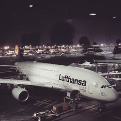 Airplane on airport runway at night