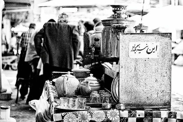 retail, for sale, market, focus on foreground, market stall, store, shop, text, incidental people, display, religion, sale, small business, men, non-western script, choice, street, consumerism, variation