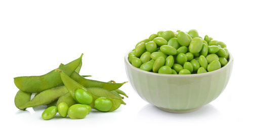 Close-up of vegetables in bowl against white background