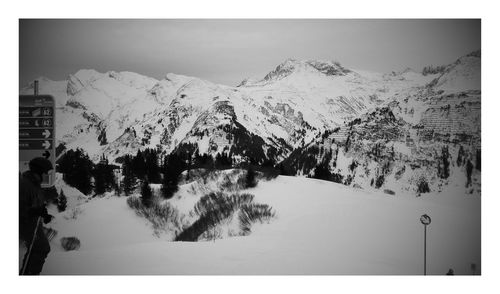 Panoramic view of snowcapped mountains against sky