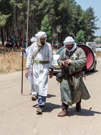 Men on road