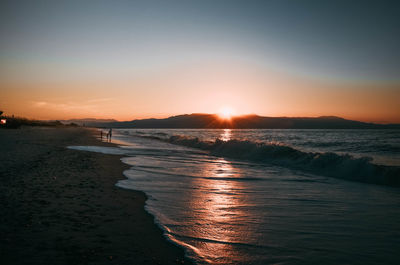 Scenic view of sea against sky during sunset