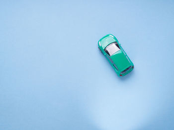 High angle view of blue colored pencils on white background