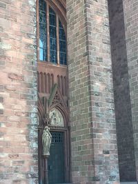 Low angle view of statue against building