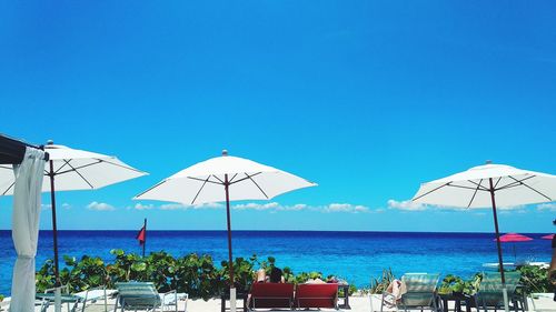 Scenic view of sea against clear blue sky