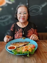 Portrait of a woman with food