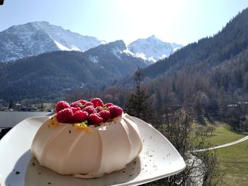 High angle view of cake with ice cream in mountains