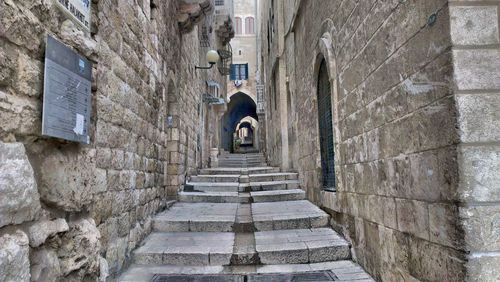 Steps amidst buildings in city