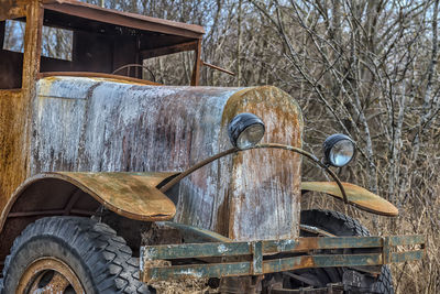 Old abandoned truck on field