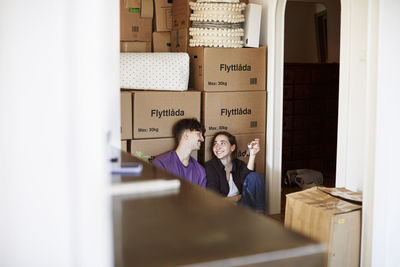 Smiling couple moving house