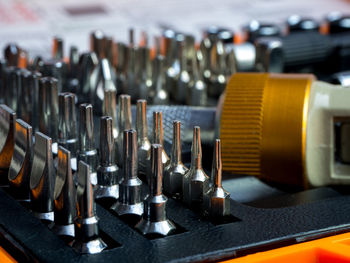 Close-up of drill bits on table