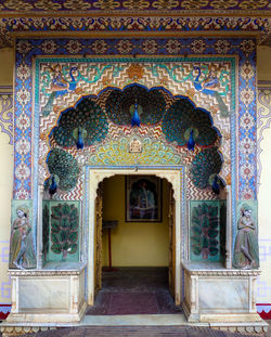 Entrance of temple against building