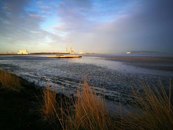 Scenic view of sea against dramatic sky