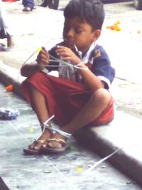 Woman holding hands while standing in water