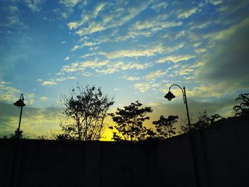 Low angle view of building against cloudy sky