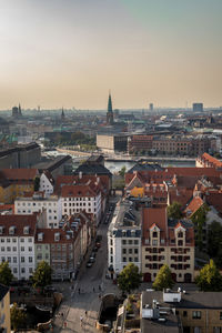 High angle view of buildings in city against sky