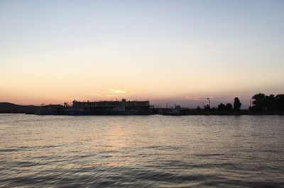 Scenic view of sea against clear sky during sunset