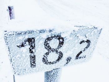 Close-up of text on snow