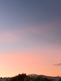 Scenic view of silhouette landscape against romantic sky at sunset