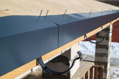 High angle view of metal railing on table