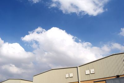 Low angle view of factory against sky