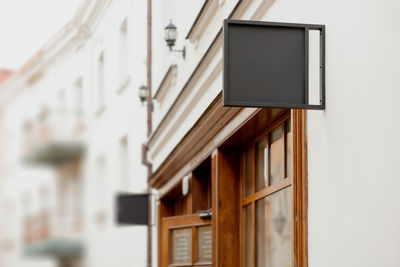 Blank signboard mock up, on the facade. copy space for your store sign or logo. 