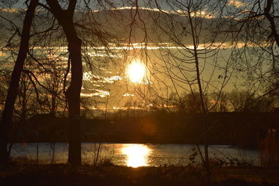 Scenic view of lake at sunset