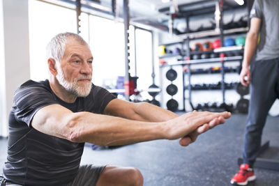 Senior man exercising in gym