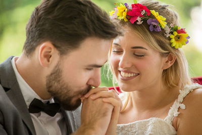 Groom kissing bride during wedding ceremony