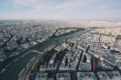 High angle view of city buildings against sky