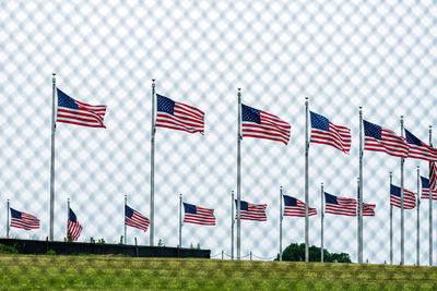 Flag flags sign against sky