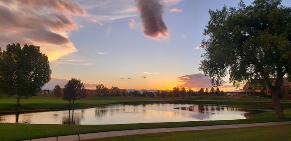 Scenic view of lake against sky during sunset