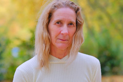 Portrait of smiling woman standing outdoors