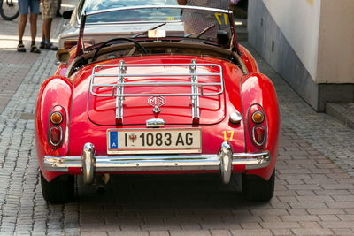 Red vintage car on street