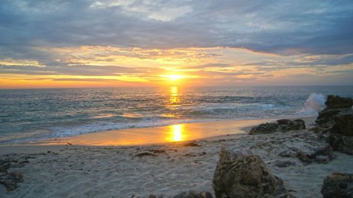 Scenic view of sea at sunset