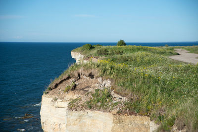 Idyllic shot of cliff in baltic sea against sky