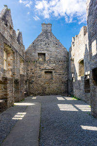 View of old ruin building against sky