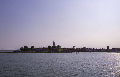 View of buildings in city against clear sky