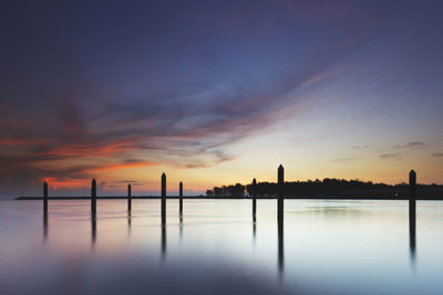 Silhouette built structure against sky during sunset