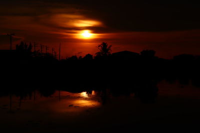 Scenic view of lake against romantic sky at sunset