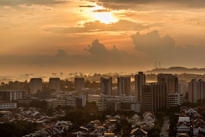 Cityscape against sky during sunset