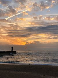 Scenic view of sea against sky during sunset